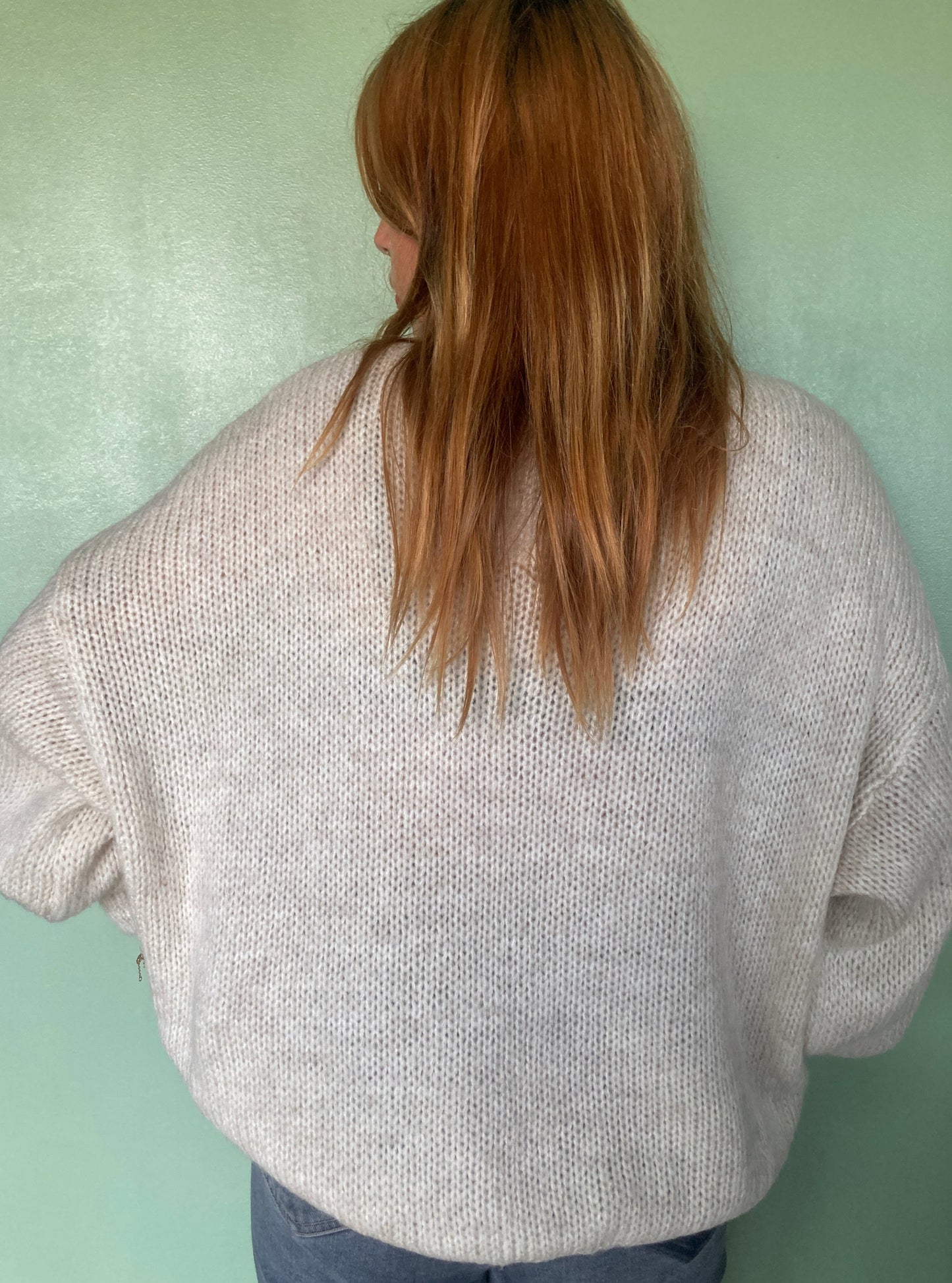 Pull beige en mohair à noeuds